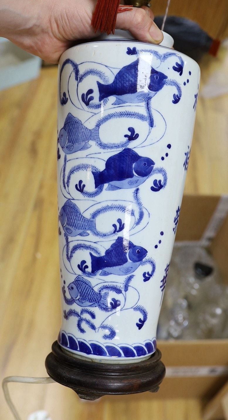 A pair of Chinese blue and white ‘fish’ lamps